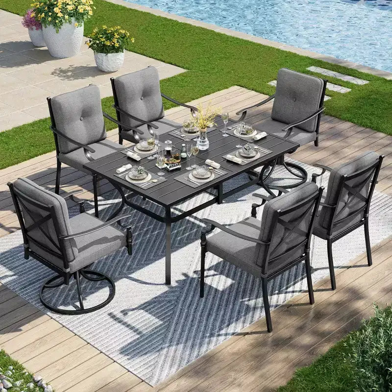 Set da pranzo da patio Captiva Designs con tavolo in acciaio a doghe e sedie in metallo con cuscini