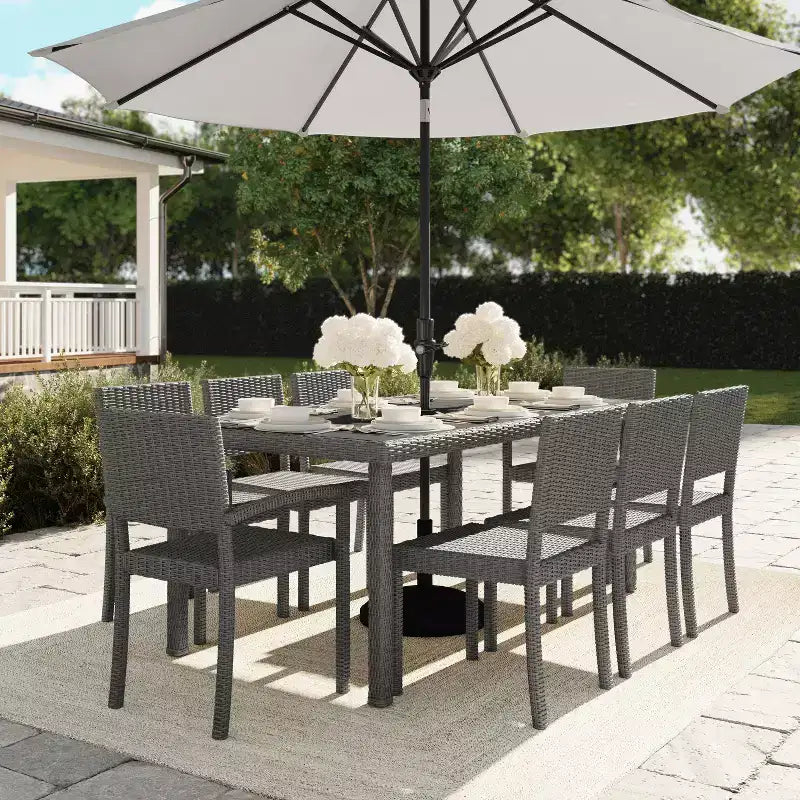 Martha Stewart Bedford 9-Piece Indoor-Outdoor Dining Set with 8 Stackable Dining Chairs and 71 Patio Table with Engineered Wood Top in Rattan Wicker